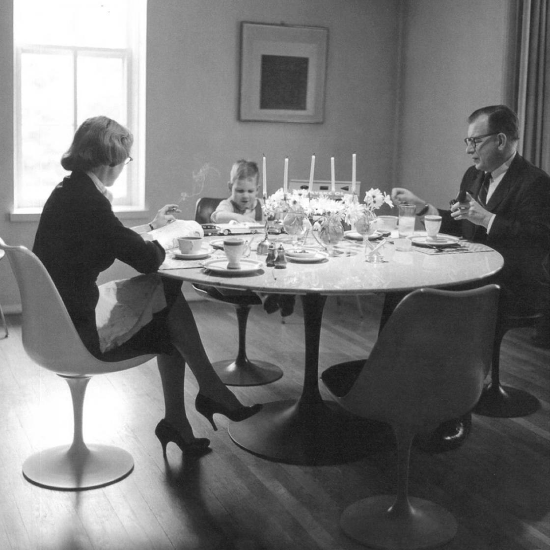 Photograph of Aline and Eero at dining table