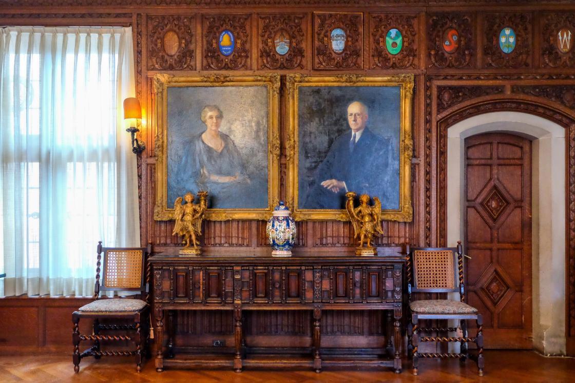Photograph of the portraits of Ellen and George Booth in the Oak Room at Cranbrook House