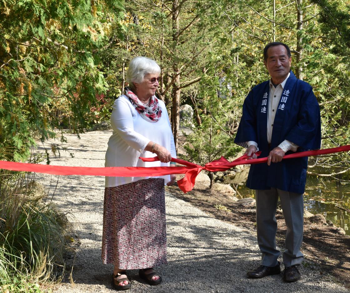Lily Pond Cascade ribbon cutting ceremony with Master gardener Hiromu Terashita and Center Patron Jeanne Graham