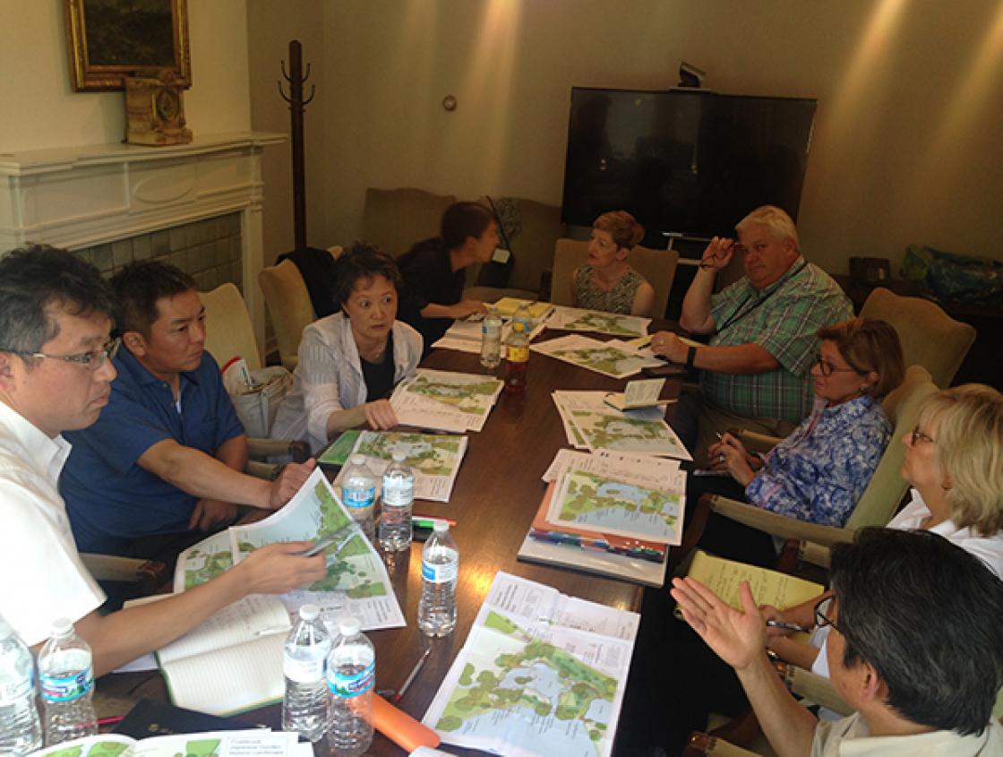 Photograph of Lily Pond Cascade Rehabilitation Planning Meeting in Cranbrook House, July 13, 2018. Attendees include (clockwise from left): Ryuichi Wakisaka (MLIT); Yasumasa Imada (Japan Federation of Lanscape Contractors); Yuki Sakai, Mayuko Chashiro, an