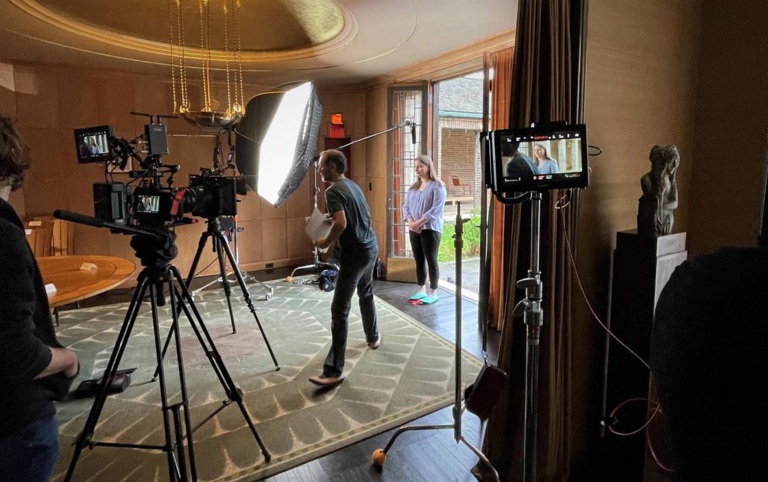 Photograph of Nina Blomfield being interviewed on the set at Saarinen House