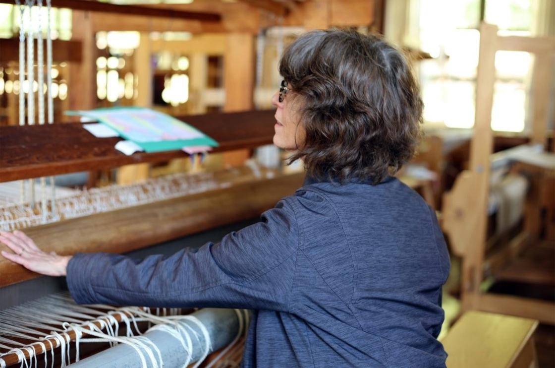 Photograph of Paula Stebbins Becker at a Cranbrook loom